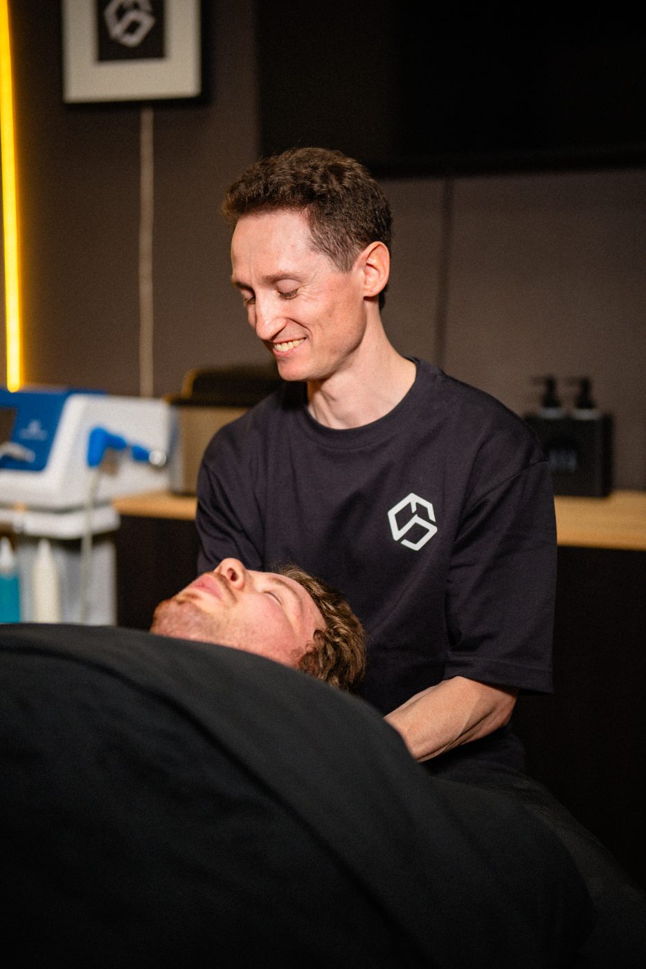 Daniel Huras treating a client on the massage table