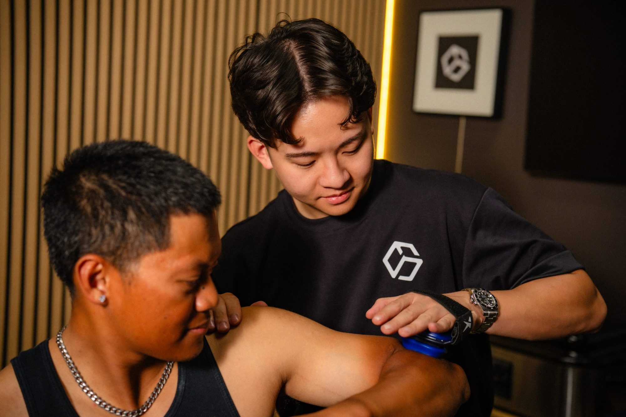 Garrett treating a client's shoulder in the clinic