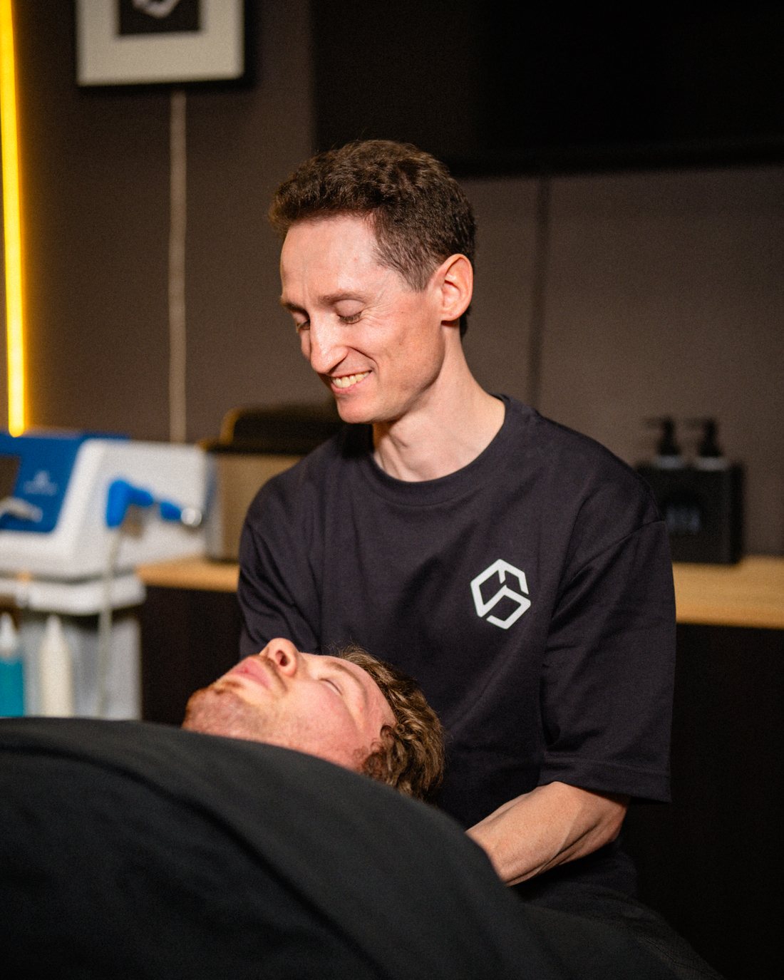 Daniel Huras treating a client on the massage table